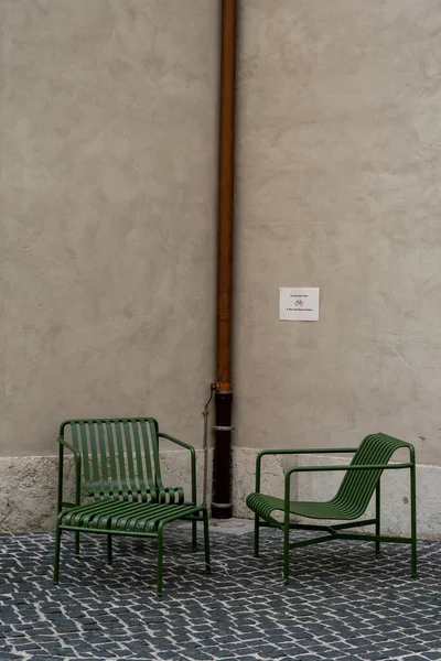 stock image A public space with stylish metal chairs and a table on the streets of Geneva. Urbanism and comfort city life concept.