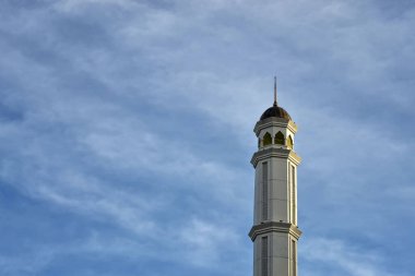 Great Mujahidin mosque minaret against a blue sky background