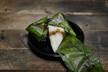 Lemper cake filled with fried coconut serundeng, a popular Indonesian food