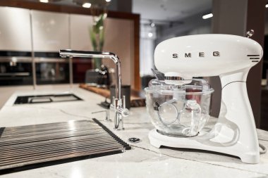 Russia, Nizhny Novgorod - January 21 2022: Kitchen appliance Store. On a kitchen worktop close-up SMEG branded mixer, appliance for easy living, a popular Italian manufacturer. High quality photo