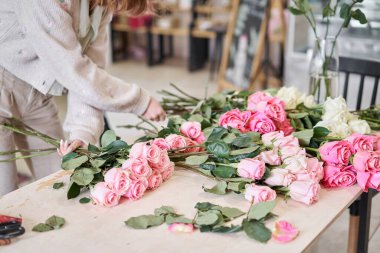 Florist prepares flowers. Fresh delivery in flower shop. High quality photo