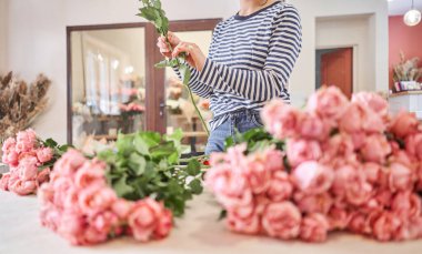 Florist prepares flowers. Fresh delivery in flower shop. High quality photo