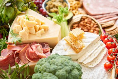 Table full of mediterranean appetizers, tapas or antipasto. Assorted Italian food set. Delicious snack on party or picnic time. Meat and cheese. Italian style banquet. . High quality photo