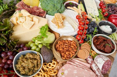 Table full of mediterranean appetizers, tapas or antipasto. Assorted Italian food set. Delicious snack on party or picnic time. Meat and cheese. Italian style banquet. . High quality photo