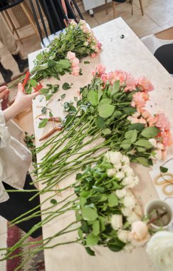 Florist prepares flowers. Fresh delivery in flower shop. High quality photo