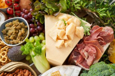 Table full of mediterranean appetizers, tapas or antipasto. Assorted Italian food set. Delicious snack on party or picnic time. Meat and cheese. Italian style banquet. . High quality photo