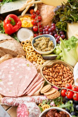 Table full of mediterranean appetizers, tapas or antipasto. Assorted Italian food set. Delicious snack on party or picnic time. Meat and cheese. Italian style banquet. . High quality photo