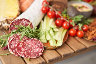 Table full of mediterranean appetizers, tapas or antipasto. Assorted Italian food set. Delicious snack on party or picnic time. Meat and cheese. Italian style banquet. . High quality photo