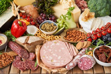 Table full of mediterranean appetizers, tapas or antipasto. Assorted Italian food set. Delicious snack on party or picnic time. Meat and cheese. Italian style banquet. . High quality photo