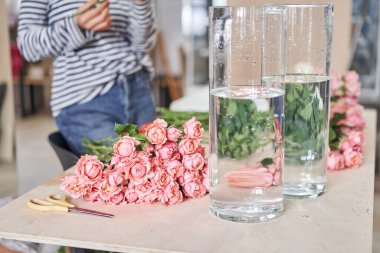 Florist prepares flowers. Fresh delivery in flower shop. High quality photo
