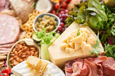 Table full of mediterranean appetizers, tapas or antipasto. Assorted Italian food set. Delicious snack on party or picnic time. Meat and cheese. Italian style banquet. . High quality photo