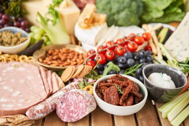 Table full of mediterranean appetizers, tapas or antipasto. Assorted Italian food set. Delicious snack on party or picnic time. Meat and cheese. Italian style banquet. . High quality photo