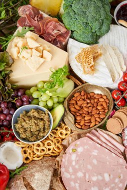 Table full of mediterranean appetizers, tapas or antipasto. Assorted Italian food set. Delicious snack on party or picnic time. Meat and cheese. Italian style banquet. . High quality photo