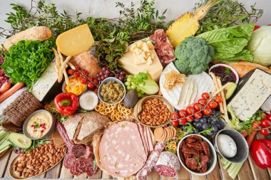 Table full of mediterranean appetizers, tapas or antipasto. Assorted Italian food set. Delicious snack on party or picnic time. Meat and cheese. Italian style banquet. . High quality photo