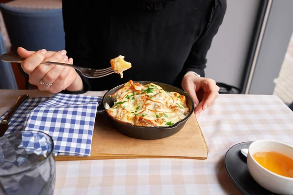 Potato Cheese Casserole Cast Iron Frying Pan Close Woman Eating — Stock Photo, Image