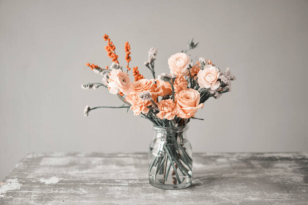 Finished flower arrangement in a vase for home. Flowers bunch, set for interior. Fresh cut flowers for decoration home. European floral shop. Delivery fresh cut flower