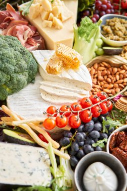 Table full of mediterranean appetizers, tapas or antipasto. Assorted Italian food set. Delicious snack on party or picnic time. Meat and cheese. Italian style banquet. . High quality photo