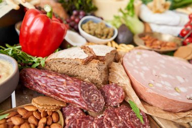 Table full of mediterranean appetizers, tapas or antipasto. Assorted Italian food set. Delicious snack on party or picnic time. Meat and cheese. Italian style banquet. . High quality photo