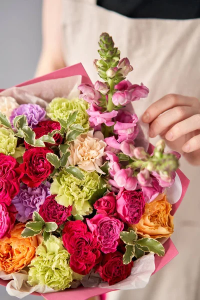 Beautiful mono bouquet of flowers in woman hand. Floral shop concept . Beautiful fresh cut bouquet. Flowers delivery.