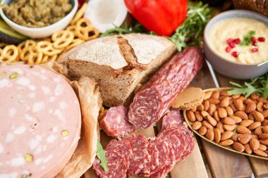 Table full of mediterranean appetizers, tapas or antipasto. Assorted Italian food set. Delicious snack on party or picnic time. Meat and cheese. Italian style banquet. . High quality photo