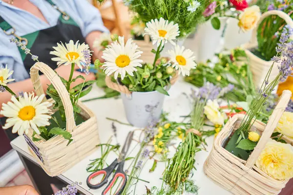 Master class on making bouquets. Spring bouquet in wicker basket. Learning flower arranging, making beautiful bouquets with your own hands. High quality photo