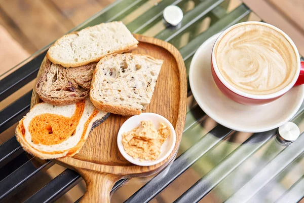 Assorted Sliced Bread Wooden Board Served Smoked Butter Breakfast Cappuccino — Stock Photo, Image