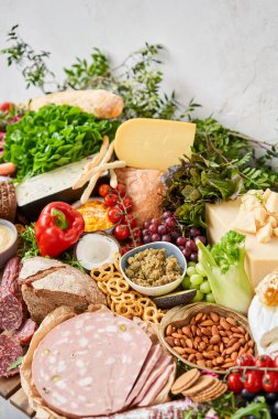 Table full of mediterranean appetizers, tapas or antipasto. Assorted Italian food set. Delicious snack on party or picnic time. Meat and cheese. Italian style banquet. . High quality photo