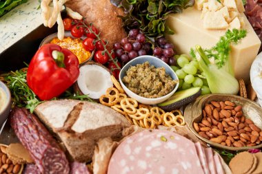 Table full of mediterranean appetizers, tapas or antipasto. Assorted Italian food set. Delicious snack on party or picnic time. Meat and cheese. Italian style banquet. . High quality photo