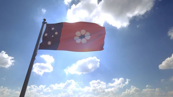 The Northern Territory Flag of Australia on a Pole with Blue Cloudy Sky in the Background Australian State Flag