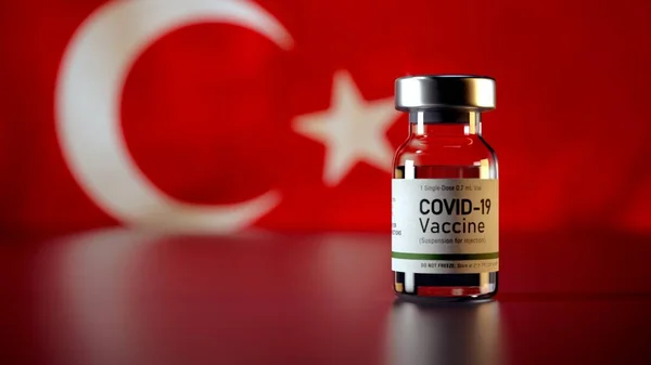 Covid Vaccine Bottle with the Turkey Flag in the Background Corona Vaccine Bottle in front of a Turkish Flag a Trk bayra