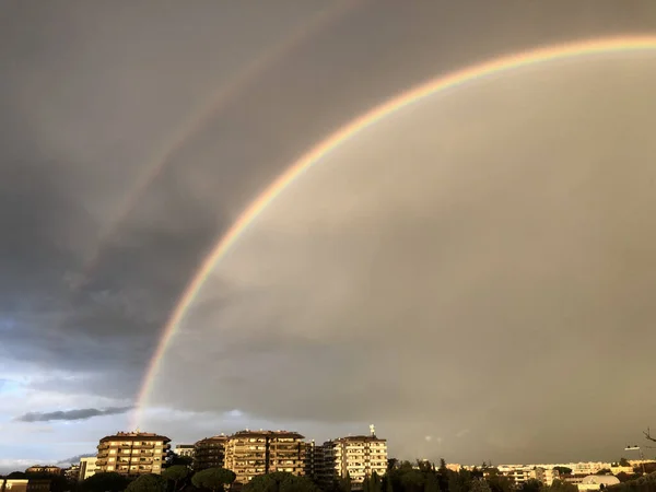 Double rainbow after storm over the city of Rome, Italy