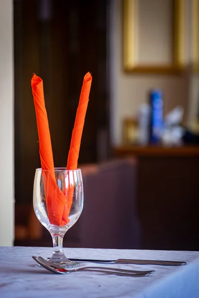 Unique Water Glass on the table at a restaurant, Restaurant drink water glass with red decoration, selective focus, blur background