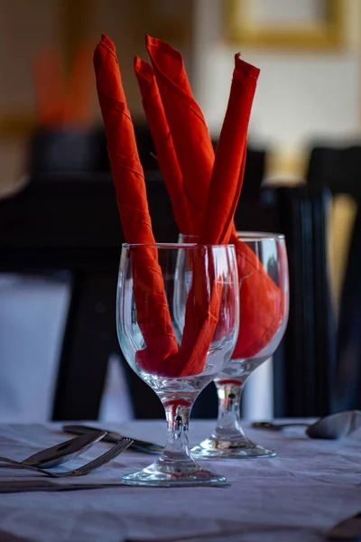 Unique Water Glass on the table at a restaurant, Restaurant drink water glass with red decoration, selective focus, blur background