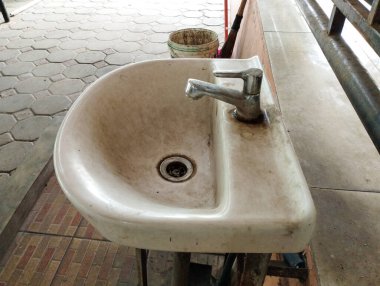 old dirty sink in the public toilet