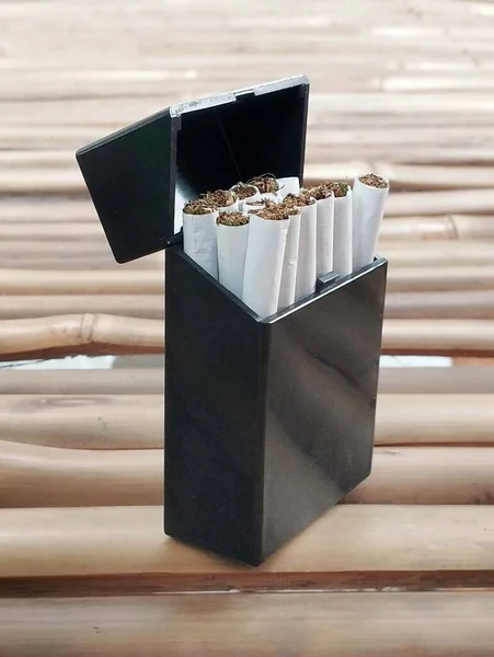 Black Cigarettes Box Matches Bamboo Table — Stock Photo, Image