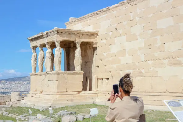 stock image Explore the architectural marvel of the Erechtheion, a captivating landmark atop the Acropolis, drawing tourists and serving as a commercial asset for travel promotions and historic appreciation
