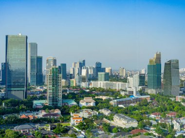 Jakarta, Indonesia - August 17, 2022: Aerial view of towering buildings at the heart of Jakarta's Business District on a sunny afternoon.