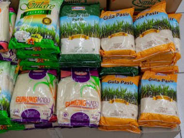 Banten, Indonesia - August 20, 2022: A pile of sugar packs stacked in display for sale at a convenience store.