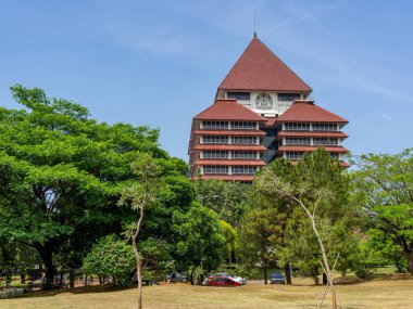 Depok, West Java, Indonesia - August 12, 2022: Rear view of the icon building of the University of Indonesia with clear blue sky on a fine morning.
