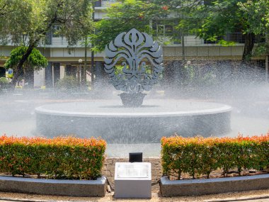 Depok, West Java, Indonesia - August 12, 2022: Close up view of the logo of the University of Indonesia standing at the middle of a fountain pool.