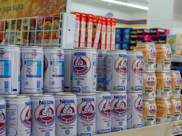 Banten, Indonesia - August 20, 2022: Cans of Bear Brand milk placed on display shelf at a convenience store.
