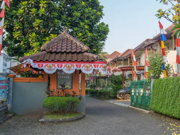 Banten, Indonesia - August 9, 2022: A security post at the gate of a housing complex decorated with the Independence Day ornaments on a sunny morning.