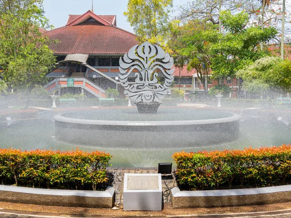 Depok, West Java, Indonesia - August 12, 2022: The Fountain Garden showing the logo of the University of Indonesia, at the Faculty of Business and Economics.