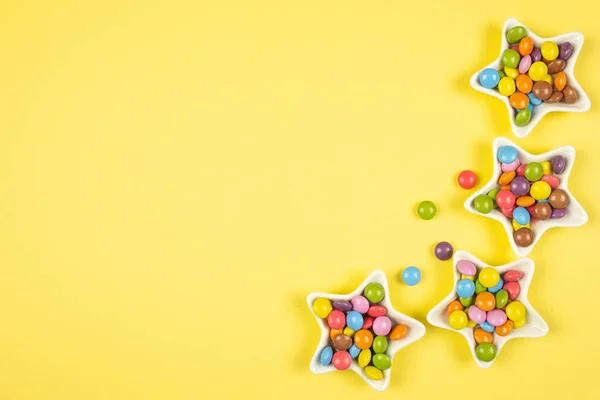Multi Colored Candies Dragee Star Bowls Yellow Background View ストック画像