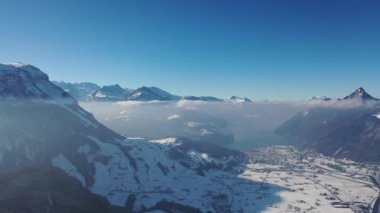 Great aerial footage in 4K on a gloriously sunny day over the snowy landscape of the canton of Lucerne in Switzerland.