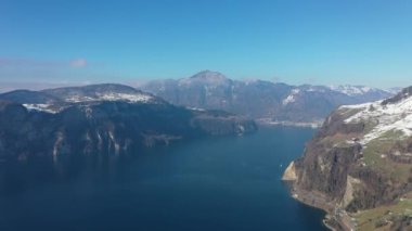 Great aerial footage in 4K over the beautiful winter landscape in the Swiss Alps.