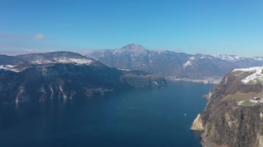Great aerial footage in 4K over the beautiful winter landscape in the Swiss Alps.