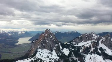 Great 4K aerial footage over the mountains of beautiful Switzerland on a stormy day.