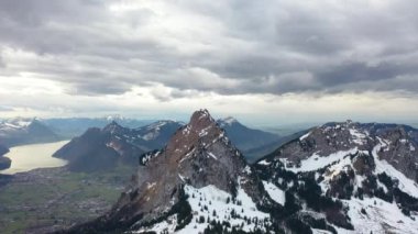 Great 4K aerial footage over the mountains of beautiful Switzerland on a stormy day.