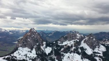Great 4K aerial footage over the mountains of beautiful Switzerland on a stormy day.